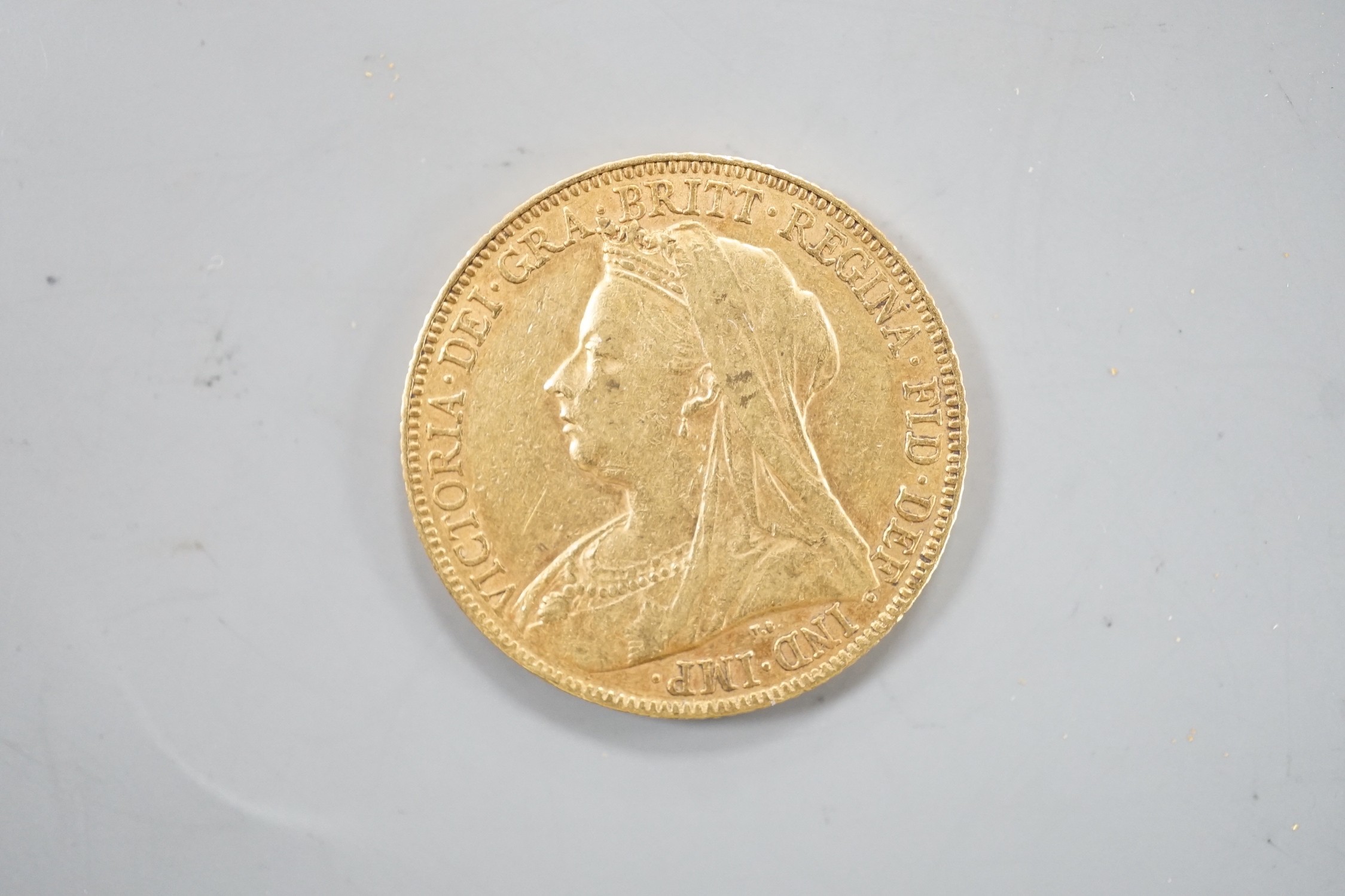 A Victoria 1899 gold sovereign.